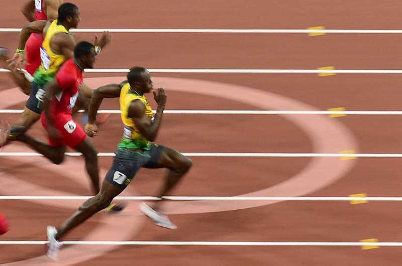 Com novo recorde olímpico, Bolt é ouro nos 100m rasos em Londres | Foto: Frabrice Coffrini / AFP / CP